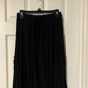 Beautiful long black skirt, new without tags. Looks great with flats or boots..